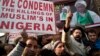 FILE - Kashmiri Shi’ite Muslims shout slogans against the Nigerian government after the army killed 348 members of a Shi'ite minority sect and detained the group’s leader during an altercation there in December, in Srinagar, Indian-controlled Kashmir, Dec. 18, 2015.