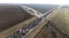 Serbian student protesters march ahead of bridge blockade as driver rams Belgrade demonstration 
