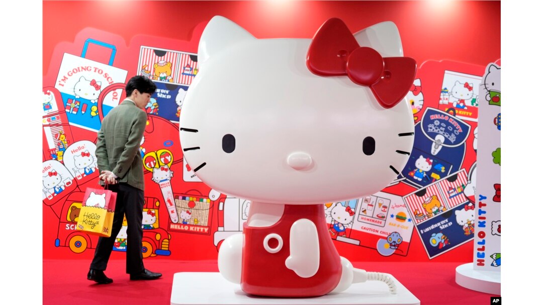 A visitor looks at giant Hello Kitty display at the exhibition "As I change, so does she," marking the 50th anniversary of Hello Kitty at the Tokyo National Museum in Tokyo, Oct. 30, 2024.