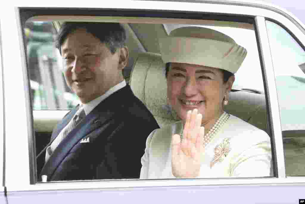 Japan's new Emperor Naruhito and new Empress Masako are driven to Imperial Palace to greet Emperor Emeritus Akihito and Empress Emerita Michiko in Tokyo.