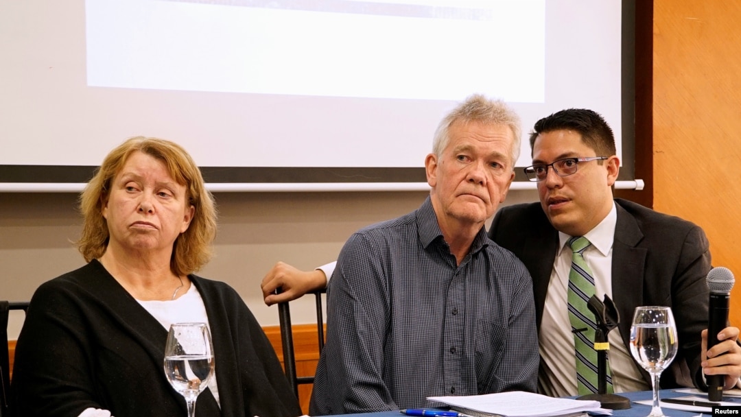 Gorel Biniel (L) and Dag Gustafsson (C), parents of Swedish software developer Ola Bini, and lawyer Carlos Soria, hold a news conference after a local judge ordered Bini jailed pending trial for alleged role in hacking government computers, in Quito, Ecuador, April 16, 2019.