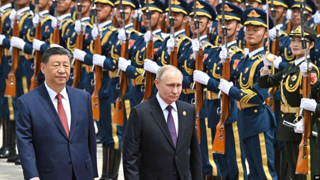 FILE - Chinese President Xi Jinping, left, and Russian President Vladimir Putin review the honor guard during a welcome ceremony in Beijing, May 16, 2024. Moscow and Beijing have long touted the strength of their relationship. (Sputnik via AP)