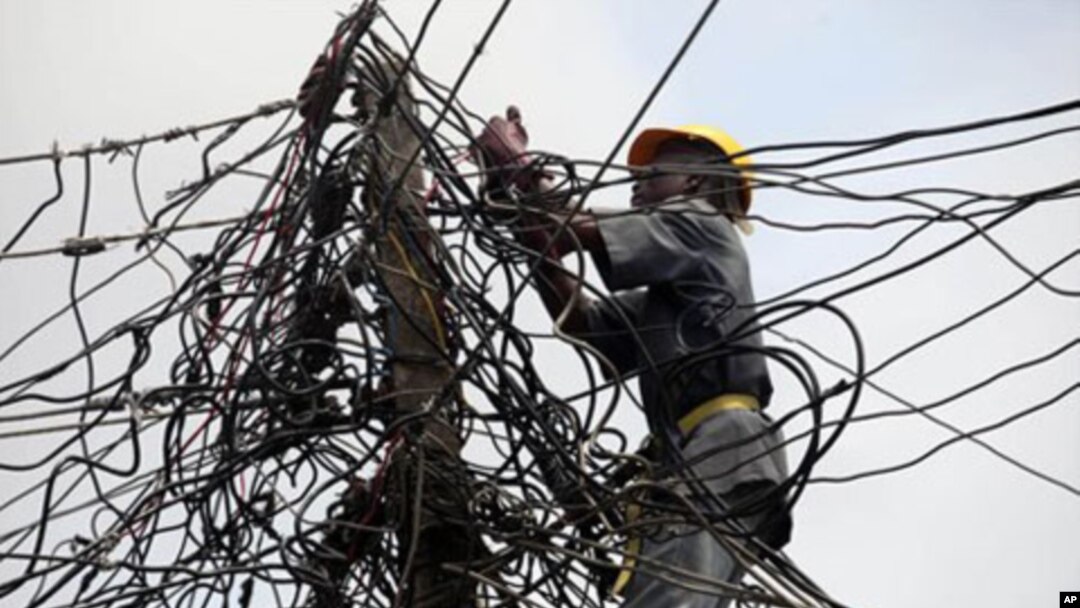 A worker of Nigeria Power works on power lines in Nigeria.