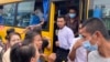 Released prisoners get off from a bus after they release from Insein Prison in Yangon, Myanmar May 3, 2023.