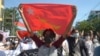 Protesters against Myanmar's junta burn the flag of the Association of Southeast Asian Nations (ASEAN), in Mandalay, Myanmar, June 5, 2021.