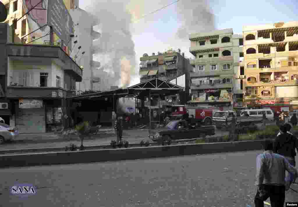 The site of a blast in Jaramana district, near Damascus, is seen in this handout photograph released by Syria's national news agency SANA, November 28, 2012.