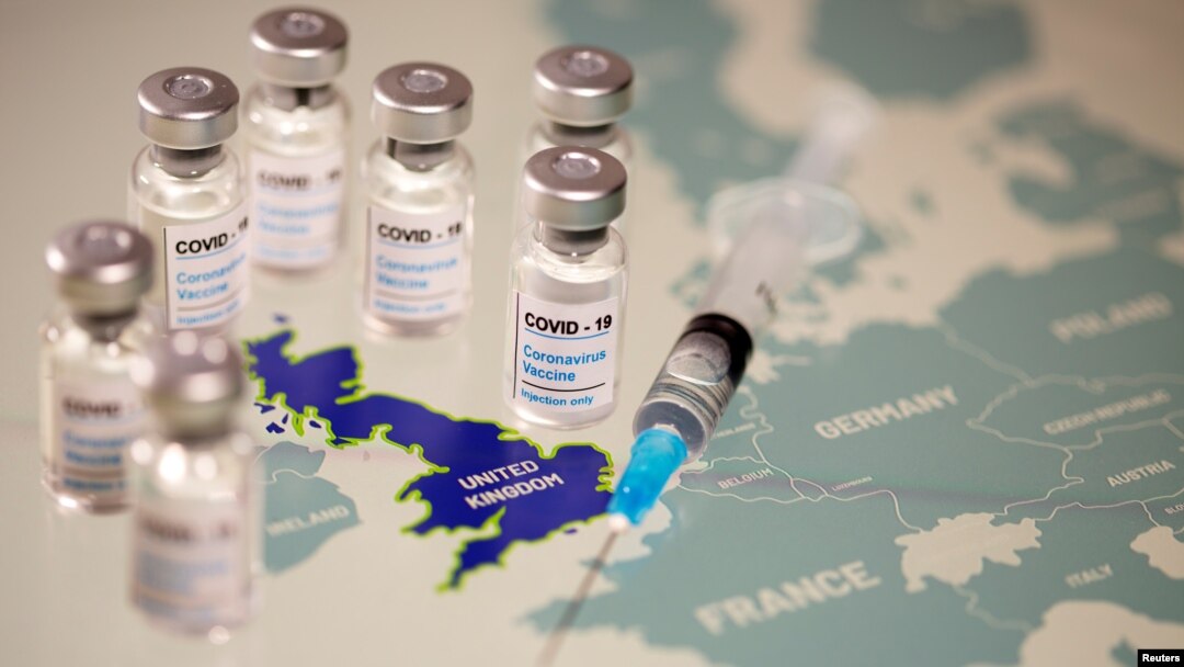  Vials labelled "COVID-19 Coronavirus-Vaccine" and a medical syringe are seen placed on the European Union map in this picture illustration taken December 2, 2020.