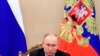 Russian President Vladimir Putin leads a cabinet meeting in the Kremlin in Moscow, Russia, March 17, 2020. 