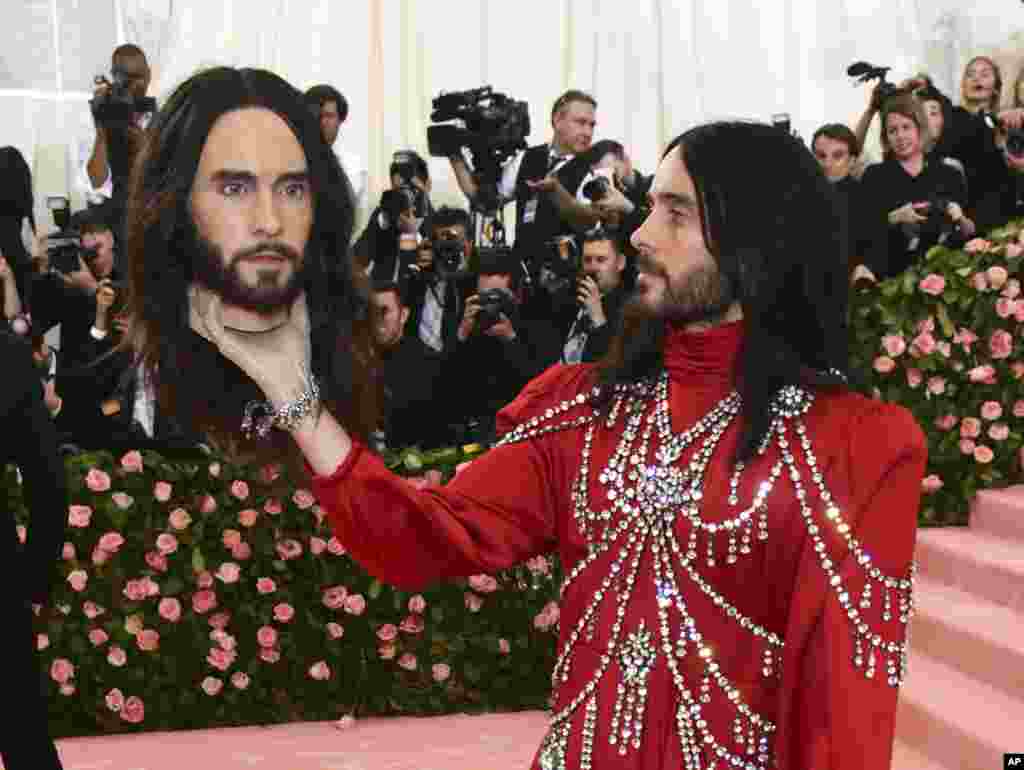 Jared Leto, holding a model of his own head, attends the Metropolitan Museum of Art's Costume Institute benefit gala, May 6, 2019, in New York.