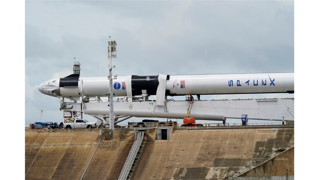 The SpaceX Falcon 9, with Dragon crew capsule, is serviced on Launch Pad 39-A, May 26, 2020, at the Kennedy Space Center in Cape Canaveral, Florida.