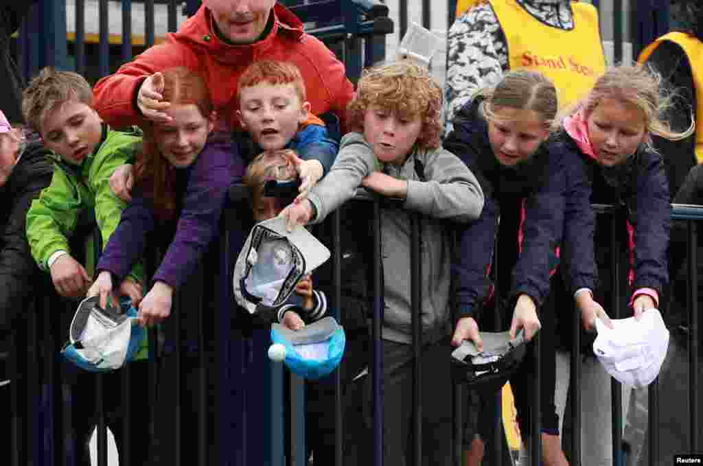 A young fan catches a ball thrown by Republic of Ireland's Padraig Harrington on the 18th during the second round of the 148th Open Championship at the Royal Portrush Golf Club, Portrush, Northern Ireland.