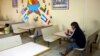 A migrant eats at Casa del Migrante, a shelter that has a capacity of more than 500 people but is currently housing only 74. Shelter administrators say they have received fewer numbers than expected in recent weeks in Ciudad Juarez, Mexico, Feb. 25, 2025. 