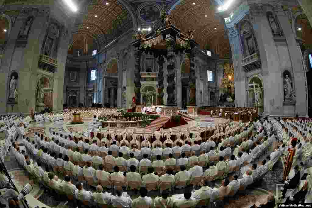 Pope Francis holds the Chrism Mass on Holy Thursday, during Easter Holy Week, at Saint Peter's Basilica at the Vatican.