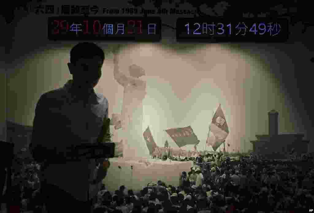 A photograph of a statue of the 'Goddess of Democracy' during the 1989 pro-democracy movement in Beijing, is displayed at the June 4th Museum in Hong Kong.