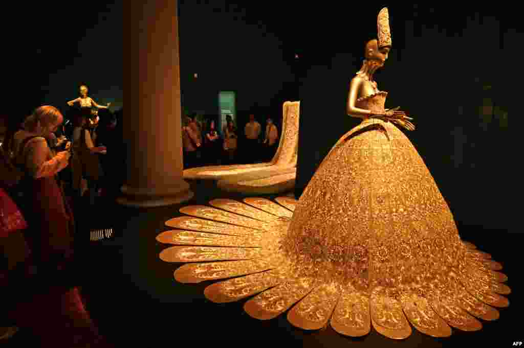 A collection of embroidered dresses created by Chinese designer Guo Pei are displayed at the Asian Civilisations Museum during a preview of the exhibition, "Guo Pei: Chinese Art and Couture" in Singapore.