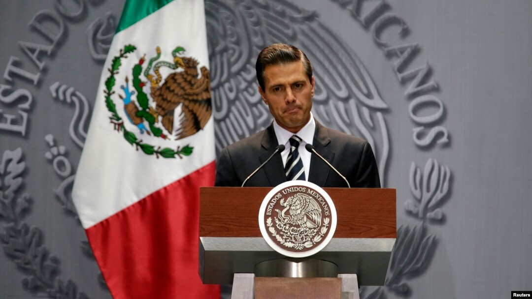 Mexico's President Enrique Peña Nieto delivers a message at the National Palace in downtown Mexico City, Oct. 6, 2014.