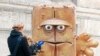 FILE - A journalist takes footage of a statue of "Bernd das Brot" in front of City Hall in Erfurt, Germany, Feb. 4, 2009. "Bernd das Brot" is a talking loaf of bread from a children's TV show. 