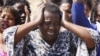 An unidentified woman cries as she protests against the police opening fire and killing striking mine workers a day earlier at the Lonmin Platinum Mine, August 17, 2012. 