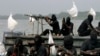FILE - Militants are seen patrolling the creeks of the Niger delta region of Nigeria, Jan. 30, 2007. A key group, the Niger Delta Avengers, did not send representatives to Tuesday's talks.