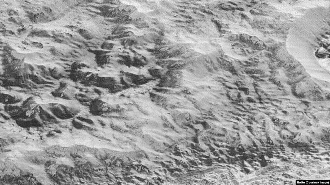 This highest-resolution image from NASA’s New Horizons spacecraft shows how erosion and faulting have sculpted this portion of Pluto’s icy crust into rugged badlands topography, Dec. 4, 2015.