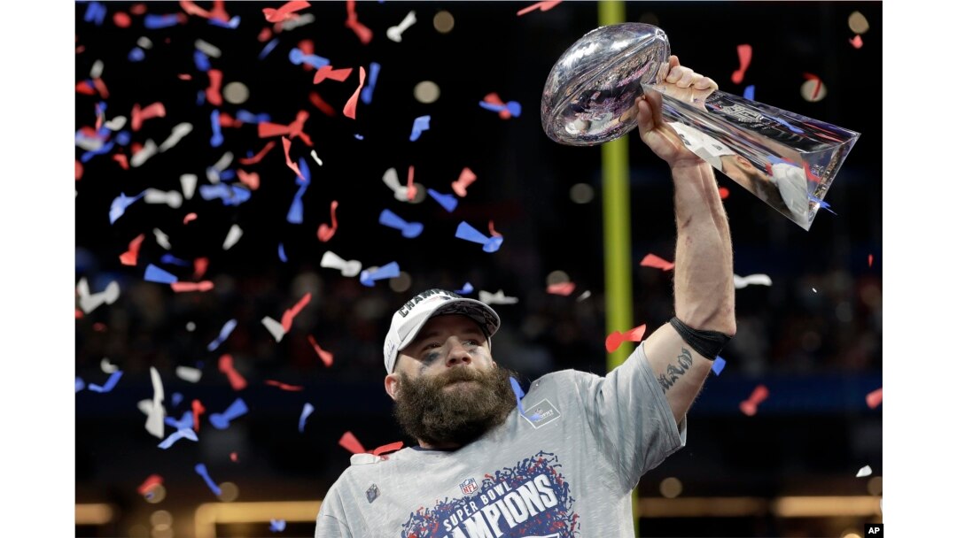 New England Patriots' Julian Edelman holds the trophy after the NFL Super Bowl 53 football game against the Los Angeles Rams, Sunday, Feb. 3, 2019, in Atlanta.