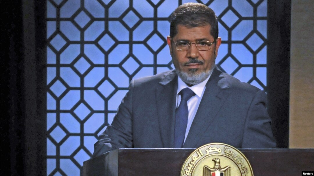 Egypt's President-elect Mohamed Morsi speaks during his first televised address to the nation at the Egyptian Television headquarters, Cairo June 24, 2012.
