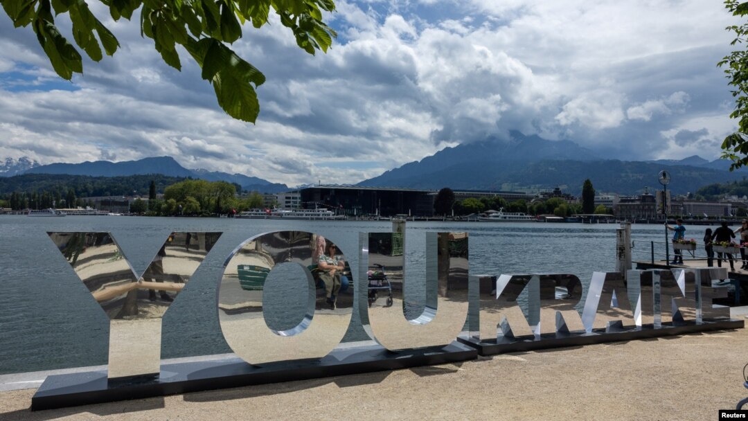 A sign is displayed in front of the Burgenstock Resort ahead of the Ukraine Peace Summit near Lucerne, Switzerland, June 14, 2024.