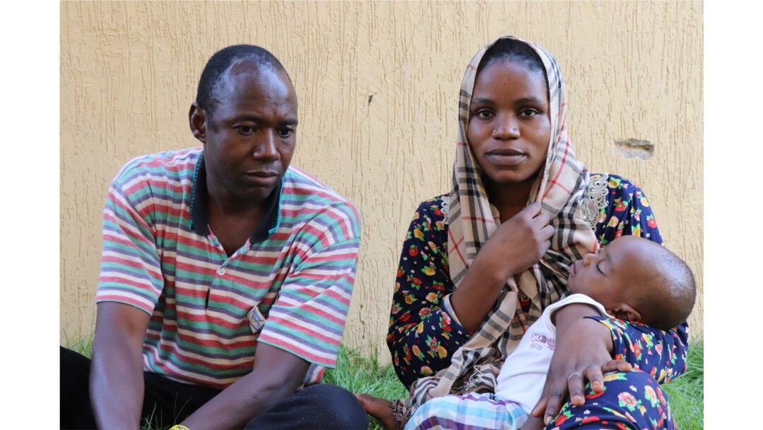 Mercy, and her baby, Hamza, are detained after a smuggler's boat she tried to take to Europe nearly sank off the coast of Libya, in Tripoli, Libya, July 2, 2019. (H. Murdock/VOA)