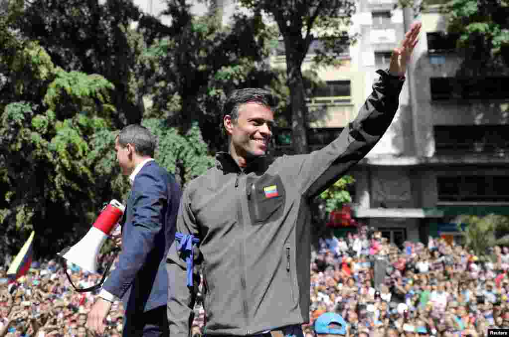 Venezuelan opposition leader Juan Guaido, who many nations have recognized as the country's rightful interim ruler and fellow opposition leader Leopoldo Lopez address a crowd of supporters in Caracas. Lopez who had been put under house arrest by President Nicolas Maduro, was "freed" by soldiers supporting Guaido.