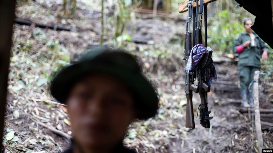 FILE - Weapons are seen at a camp of the 51st Front of the Revolutionary Armed Forces of Colombia (FARC) in Cordillera Oriental, Colombia, Aug. 16, 2016. 