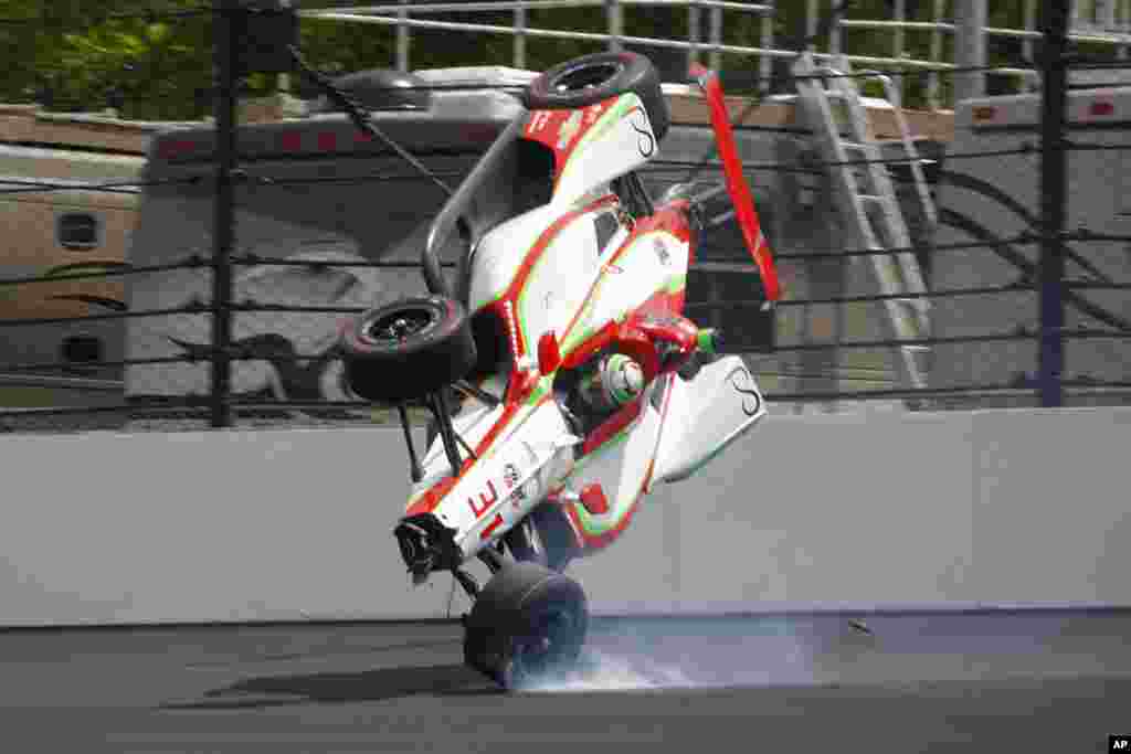 The car driven by Patricio O'Ward, of Mexico, goes airborne after hitting the wall in the second turn during practice for the Indianapolis 500 IndyCar auto race at Indianapolis Motor Speedway in Indianapolis.