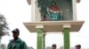 FILE - Members of the police stand guard in front of a replica of Pieta at Holy Rosary Church in Dhaka.