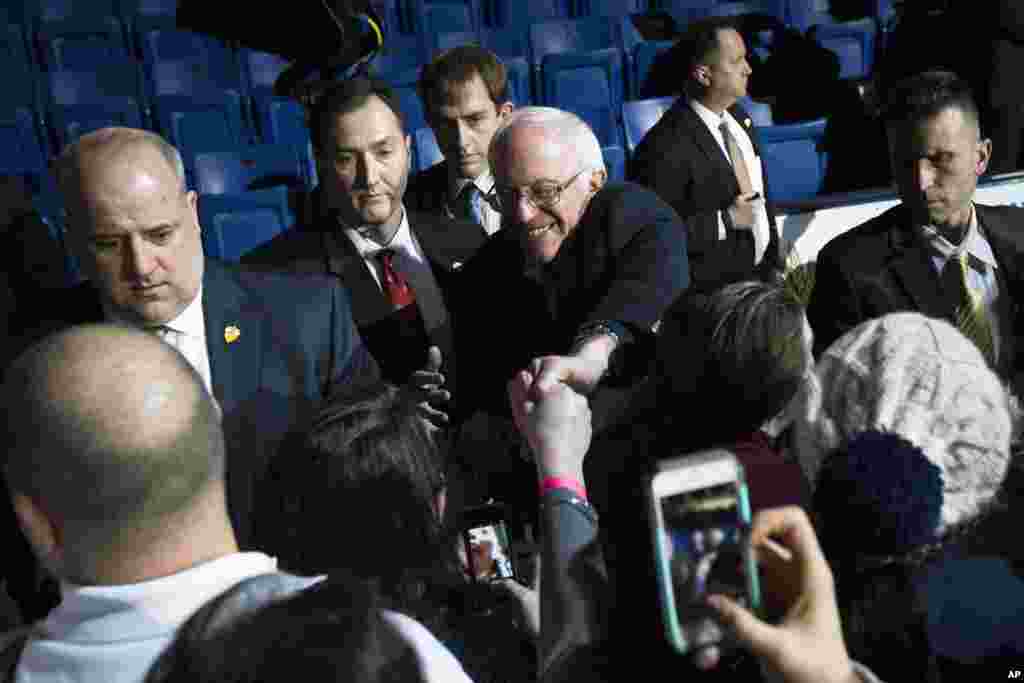 Democratic presidential candidate Sen. Bernie Sanders, I-Vt., shakes hands with attendees during a campaign stop at the University of New Hampshire Whittemore Center Arena, Feb. 8, 2016, in Durham, N.H.