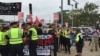 First clash with police - stopped counter-protestors because of picket signs