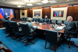 FILE - President Joe Biden held a secure video call with President Vladimir Putin of Russia, Dec. 7, 2021.