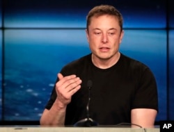 FILE- In this Feb. 6, 2018, photo, Elon Musk, founder, CEO of SpaceX and CEO of Tesla Inc., speaks at a news conference after the Falcon 9 SpaceX heavy rocket launched successfully from the Kennedy Space Center in Cape Canaveral, Florida.