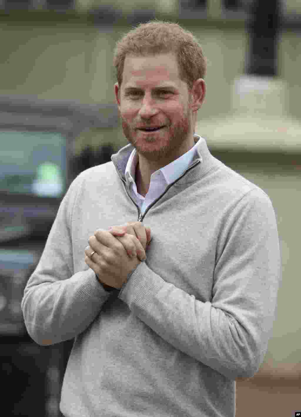 Britain's Prince Harry speaks to the members of the media at Windsor Castle, Windsor, England, after his wife Meghan, the Duchess of Sussex gave birth to a baby boy.