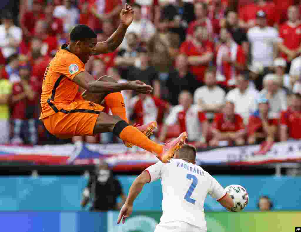 Czech Republic's Pavel Kaderabek, right, challenges Denzel Dumfries of the Netherlands during the Euro 2020 soccer championship round of 16 match between Netherlands and Czech Republic at the Ferenc Puskas stadium in Budapest, Hungary.