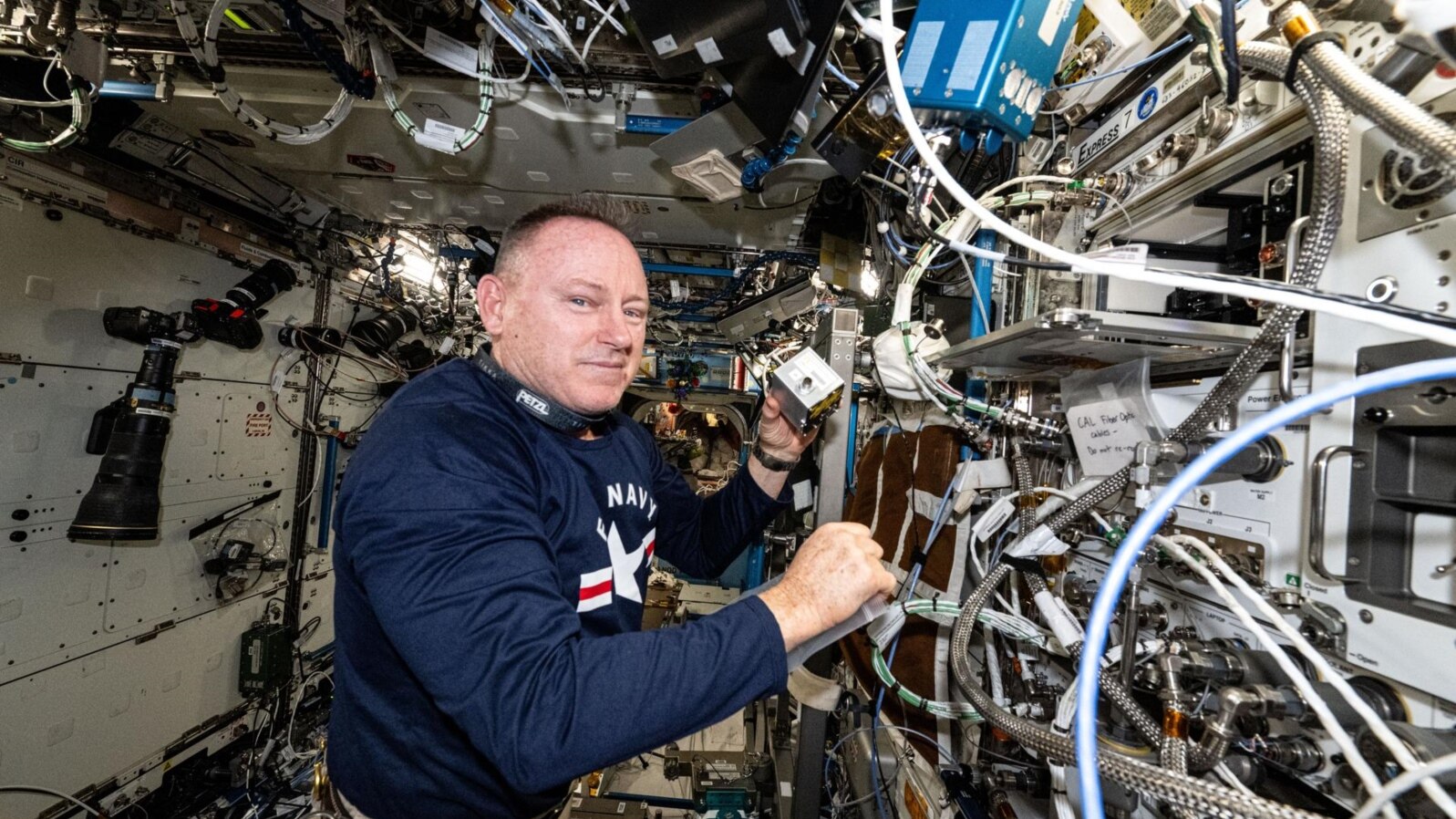 NASA astronaut Butch Wilmore shows research hardware for a study that explores 3D printing of on-demand medical devices on the International Space Station on Dec. 2, 2024.