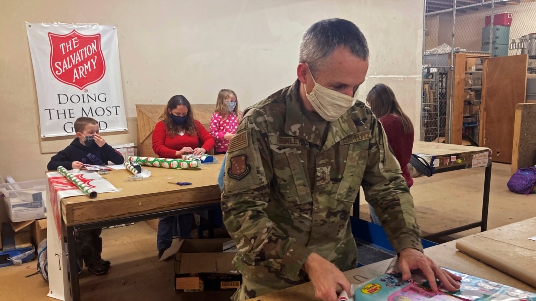 Chief Master Sgt. Winfield Hinkley Jr., Command Senior Enlisted Leader of the Alaska National Guard, wraps a gift in Anchorage, Alaska, that will be sent to a child in one of three rural Alaska villages, on Nov. 17, 2020.