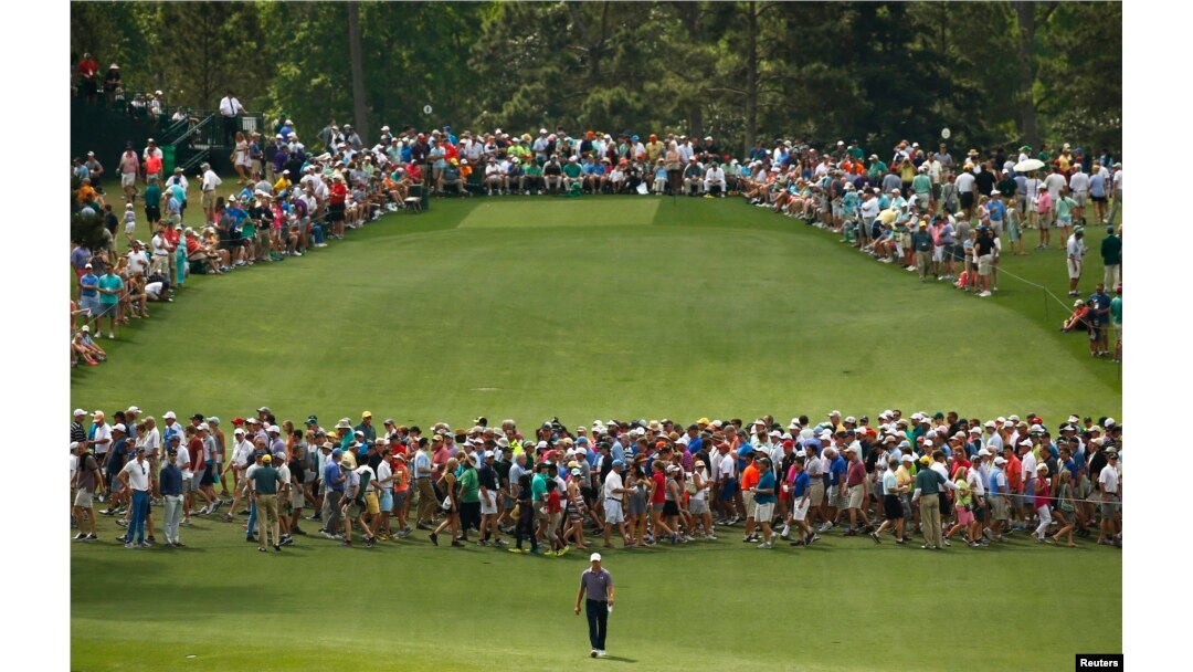 Jordan Spieth of the U.S. walks up the eighth fairway during second round play of the Masters golf tournament at the Augusta National Golf Course in Augusta, Georgia, April 10, 2015.