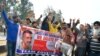 Indians dance as they wait to welcome Indian fighter pilot Wing Commander Abhinandan Varthaman at India Pakistan border at Wagah, 28 kilometers (17.5 miles) from Amritsar, India, March 1, 2019. 