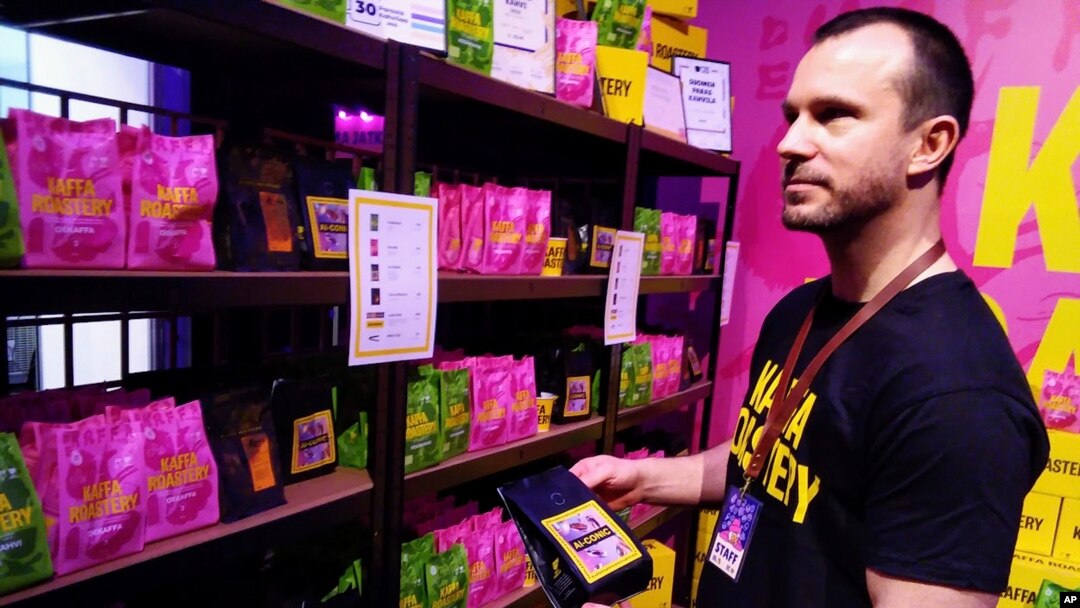 Kaffa Roastery's founder Svante Hampf shows package of "AI-conic" coffee blend generated by artificial intelligence in Helsinki, Finland, Friday April 19, 2024. (AP Photo/Jari Tanner)