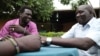 Gatdet Thong (L) meets with other "Cuban Jubans" wearing beaded bracelets with South Sudan's new flag colours, Juba, South Sudan, August 2012. (H. McNeish/VOA)