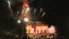 Two commencement traditions at the University of Texas at Austin: lighting up the top of the campus landmark tower in orange - the official color of the university - and fireworks at the end of the ceremony. (C. Presutti/VOA)