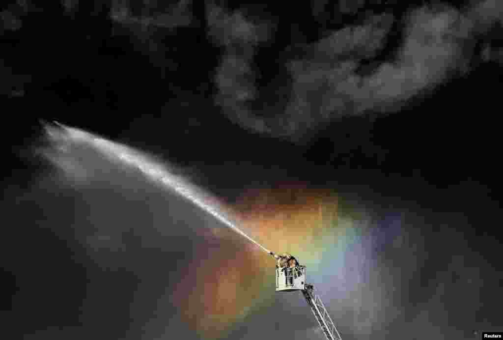 Firefighters extinguish the fire at an industrial building in Saint Petersburg, Russia.