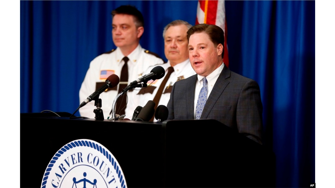 Carver County Attorney Mark Metz, right, announced April 19, 2018 in Chaska, Minnesota, that no criminal charges will be filed in the death of musician Prince in 2016.