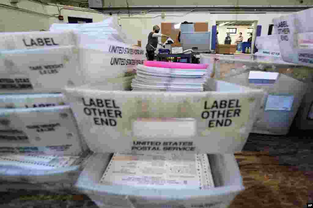 Chester County election workers scan mail-in and absentee ballots at West Chester University, in West Chester, Pennsylvania.