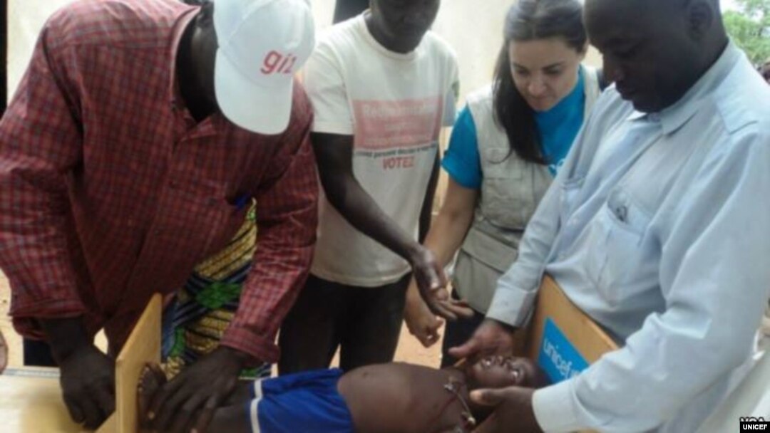 Health workers in Cameroon monitor the growth of infants and find that the growth of one-third of those children are stunted because of poor nutrition. (Courtesy UNICEF)