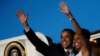 U.S. President Barack Obama and first lady Michelle Obama wave from Air Force One at the airport in Accra, July 11, 2009. 